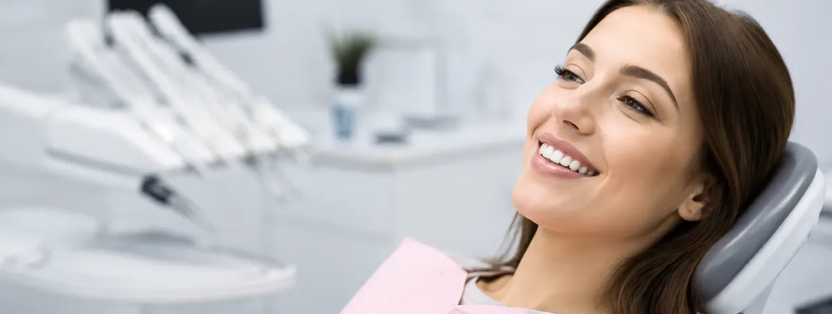 Relaxed patient smiling in the dental chair during restorative treatment